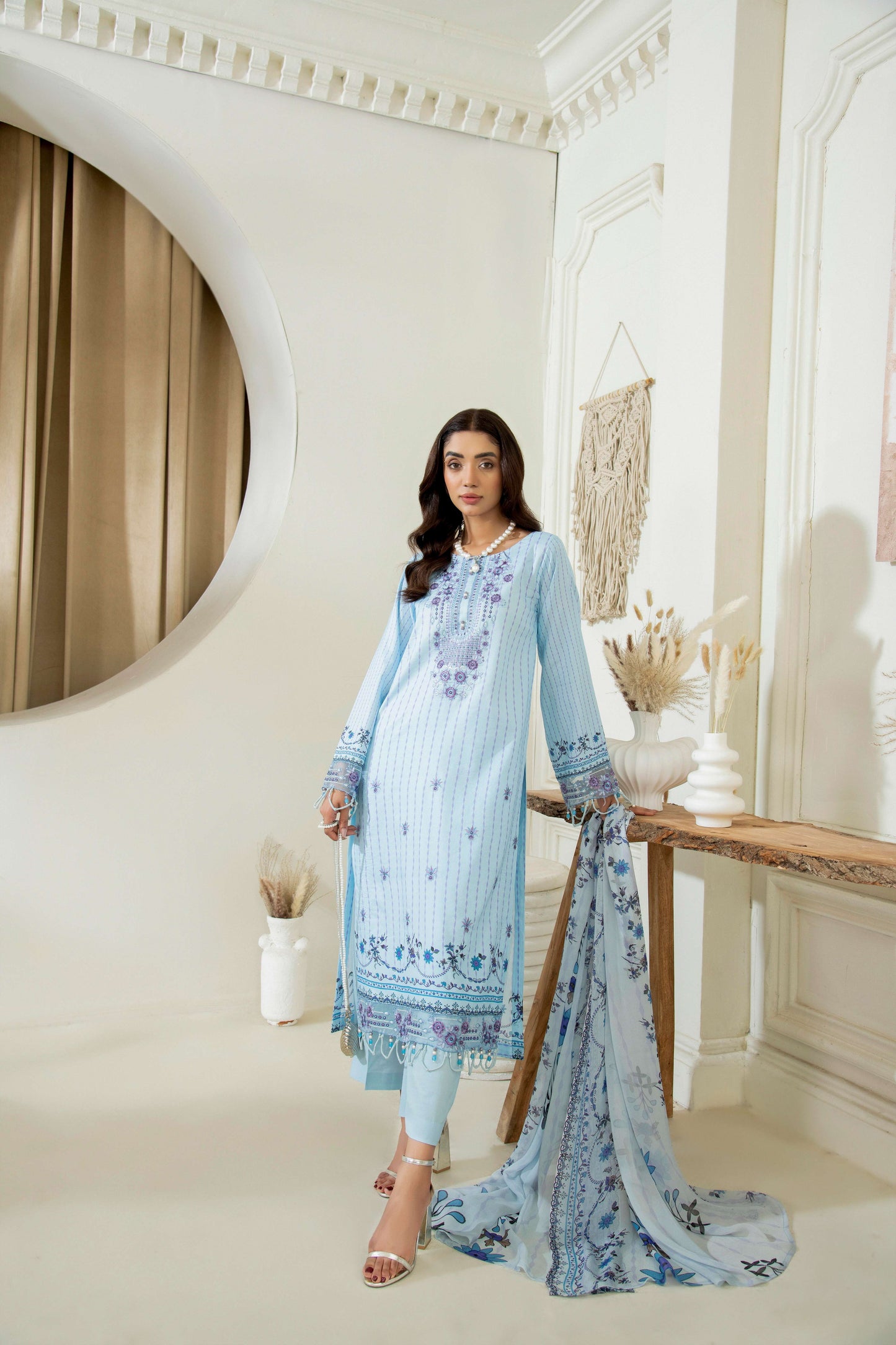 Embroidered kurta styled with straight trouser
