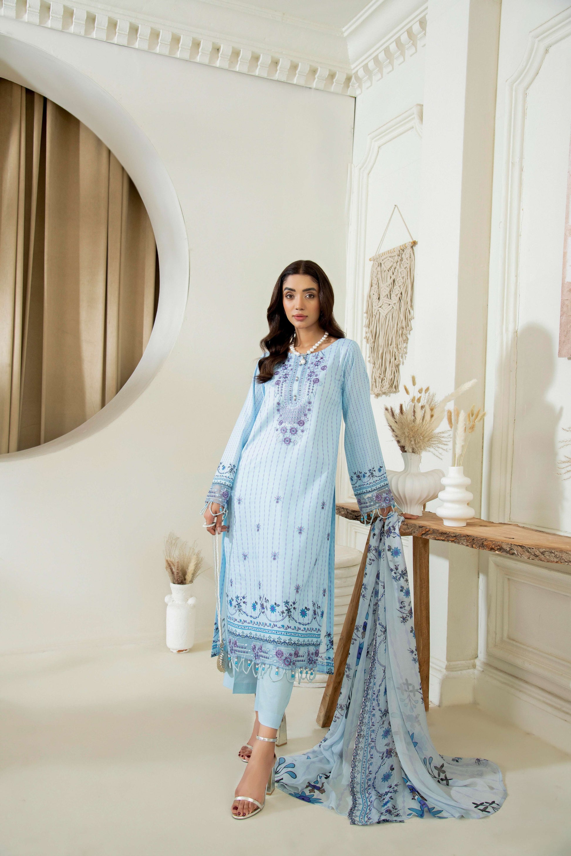 Embroidered kurta styled with straight trouser