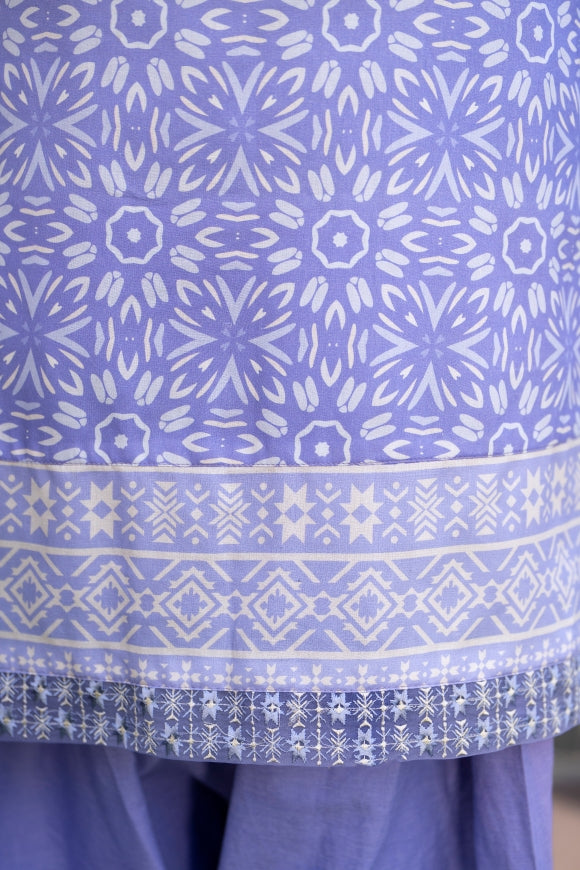 A graceful set in lawn and cotton, uplifted by a lightweight printed chiffon dupatta that adds effortless charm