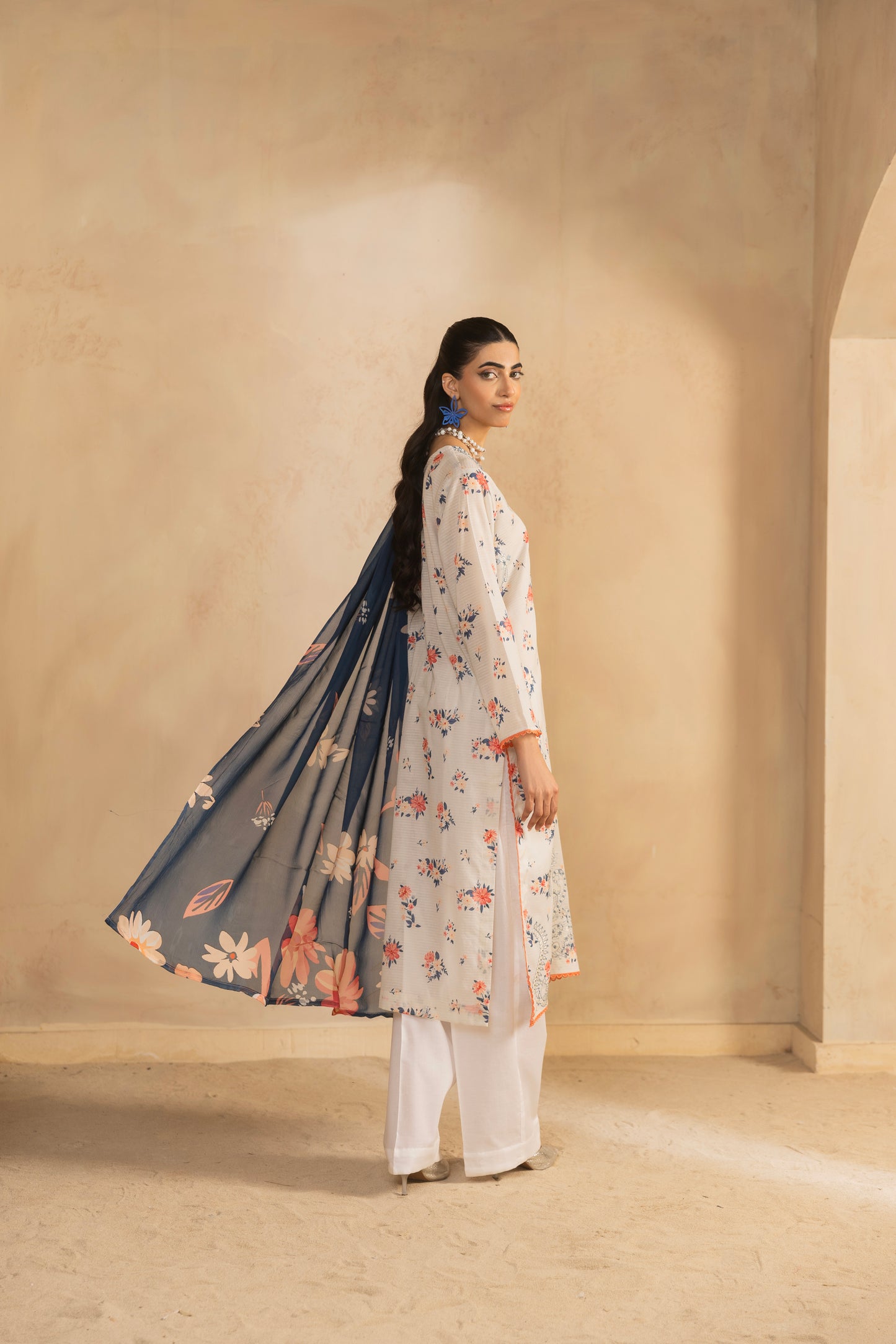 Eastern kurta design featuring embroidered lawn shirt, printed back, chiffon dupatta, and cotton trouser