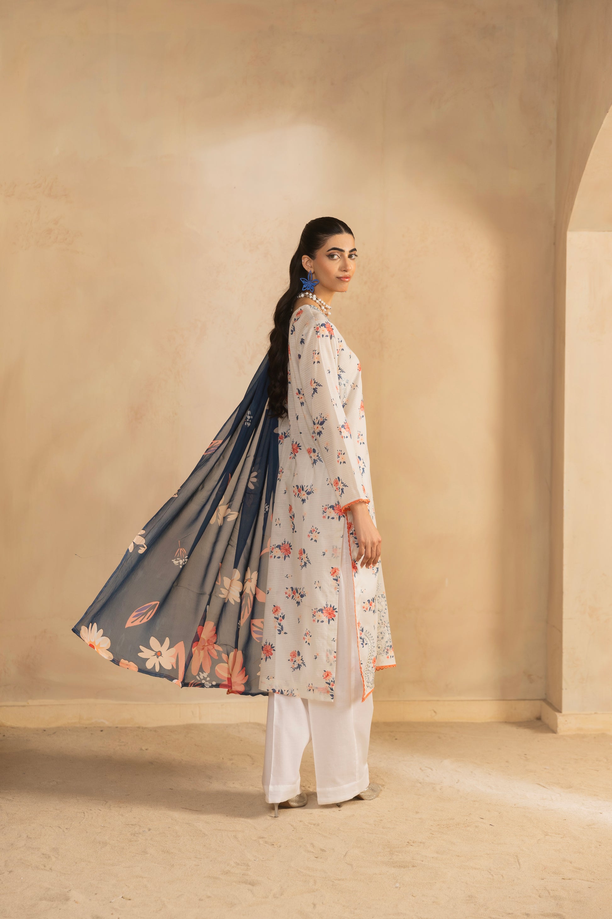 Eastern kurta design featuring embroidered lawn shirt, printed back, chiffon dupatta, and cotton trouser