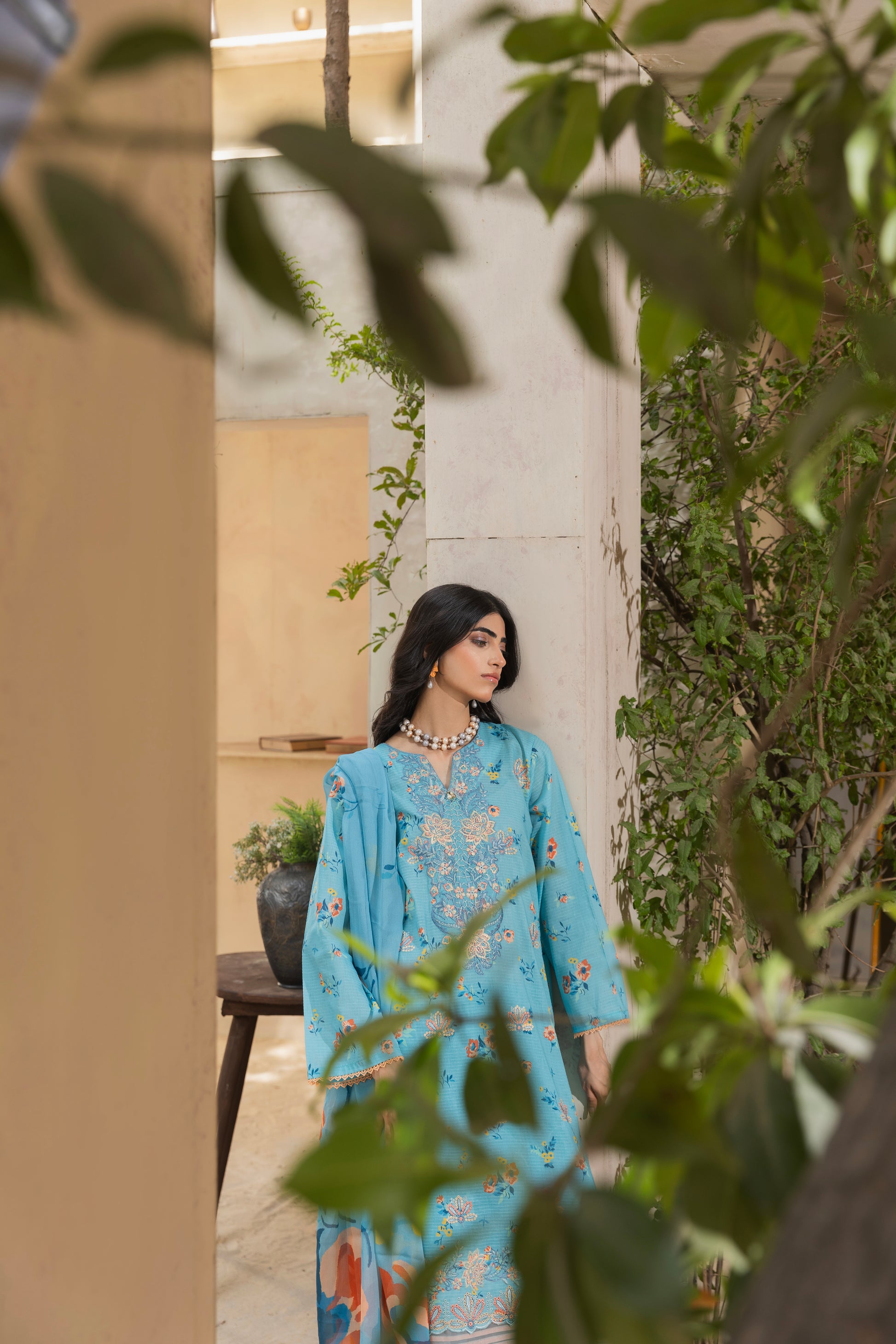 Self-check embroidered lawn suit featuring printed back, chiffon dupatta, and cotton trouser