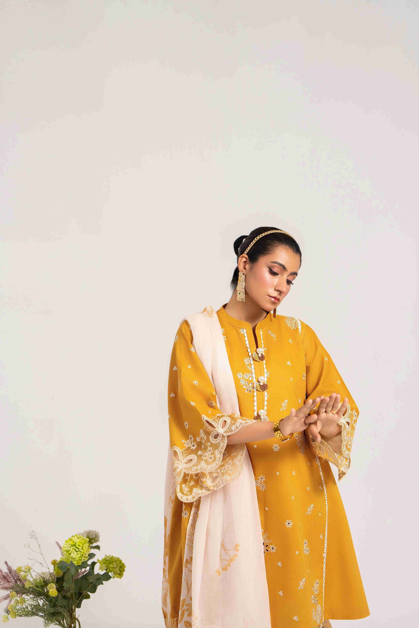  Trendy embroidered lawn shirt styled with chiffon dupatta and cotton plain trouser.