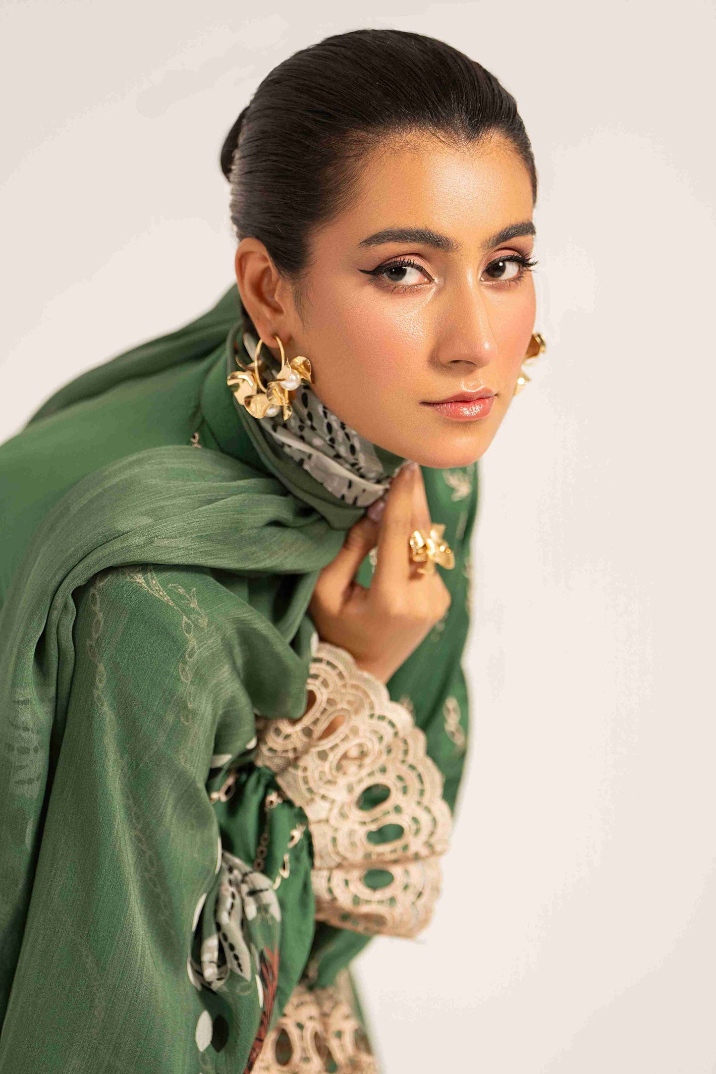 Unstitched embroidered lawn shirt styled with chiffon dupatta and plain cotton trouser