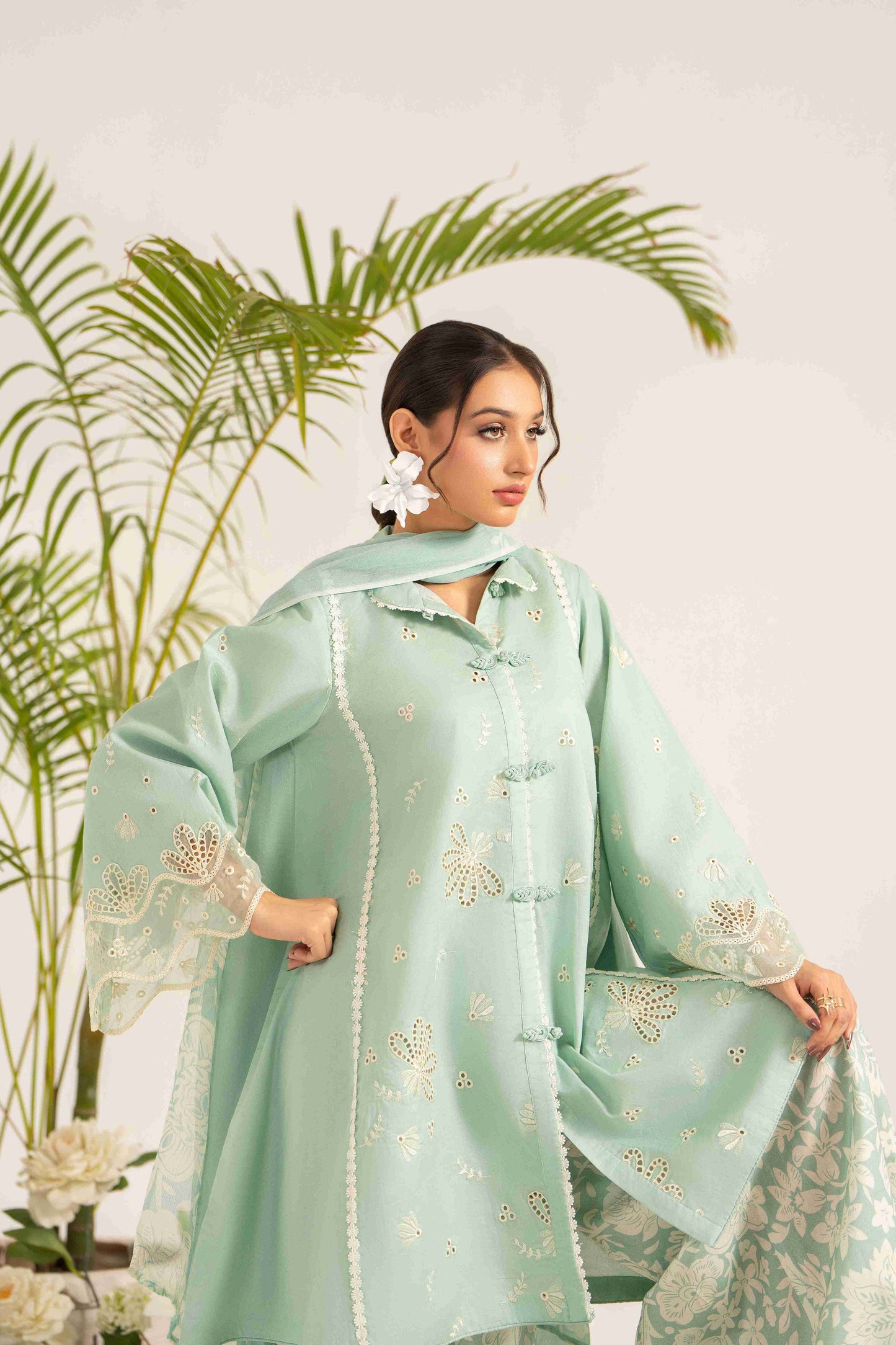 Unstitched embroidered lawn shirt styled with chiffon dupatta and plain cotton trouser.