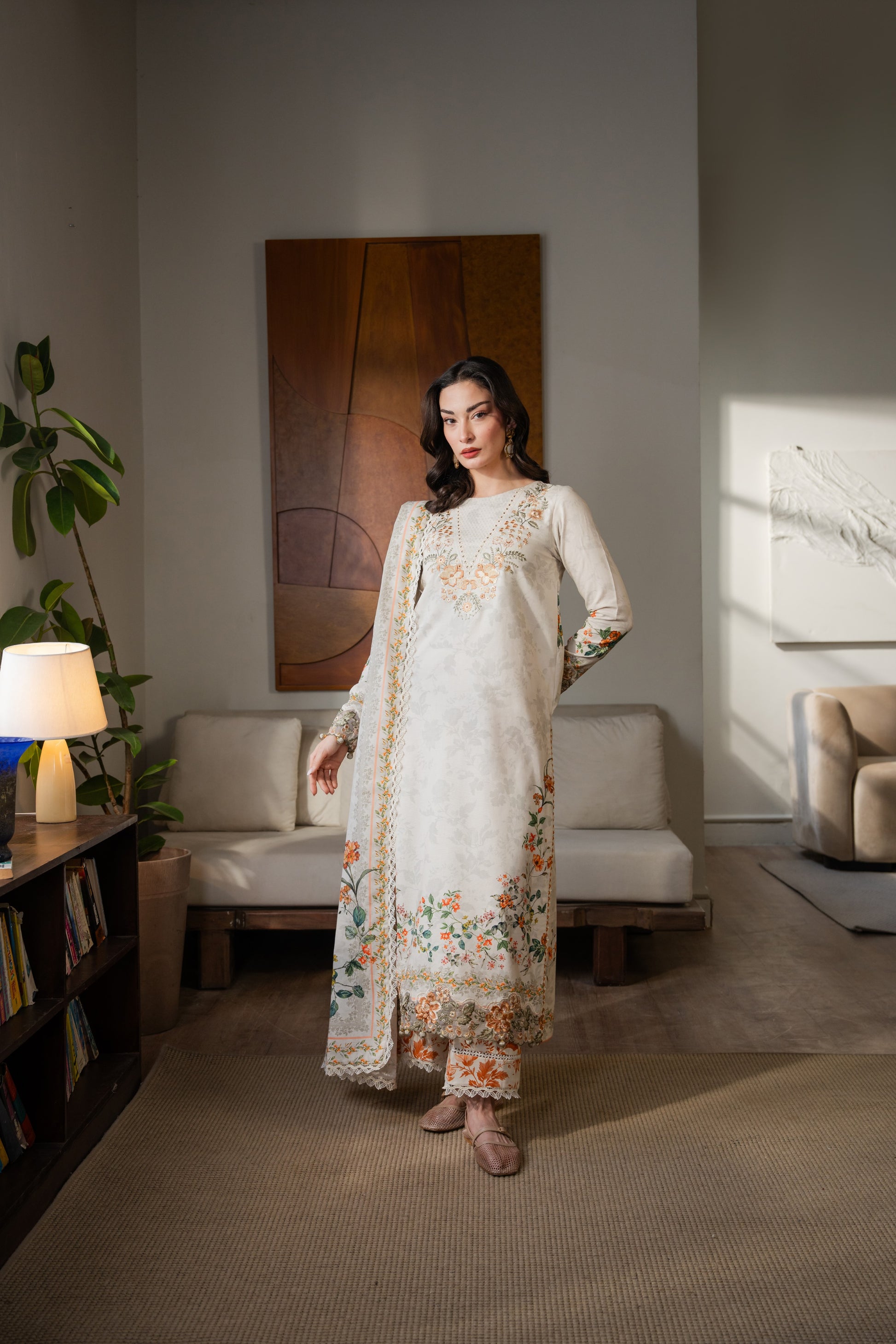 Winter khaddar outfit with fine organza embroidery and stylish printed dupatta.