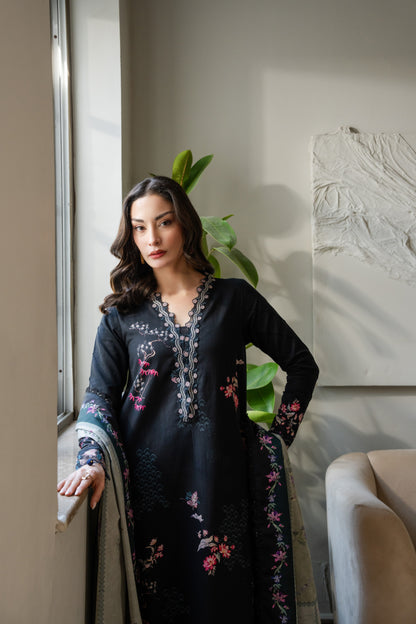 Comfortable khaddar outfit with winter-friendly fabric, organza borders, and dyed trousers.