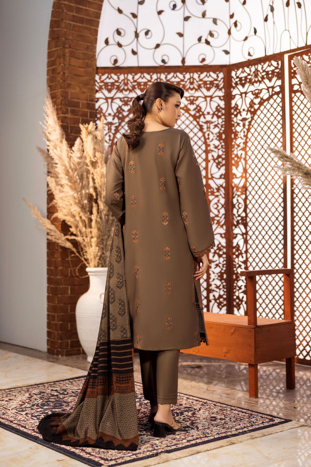 Floral embroidered winter suit with soft wool fabric and matching dupatta.