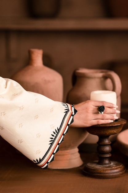 Winter embroidered suit with detailed motifs, styled for formal wedding events.