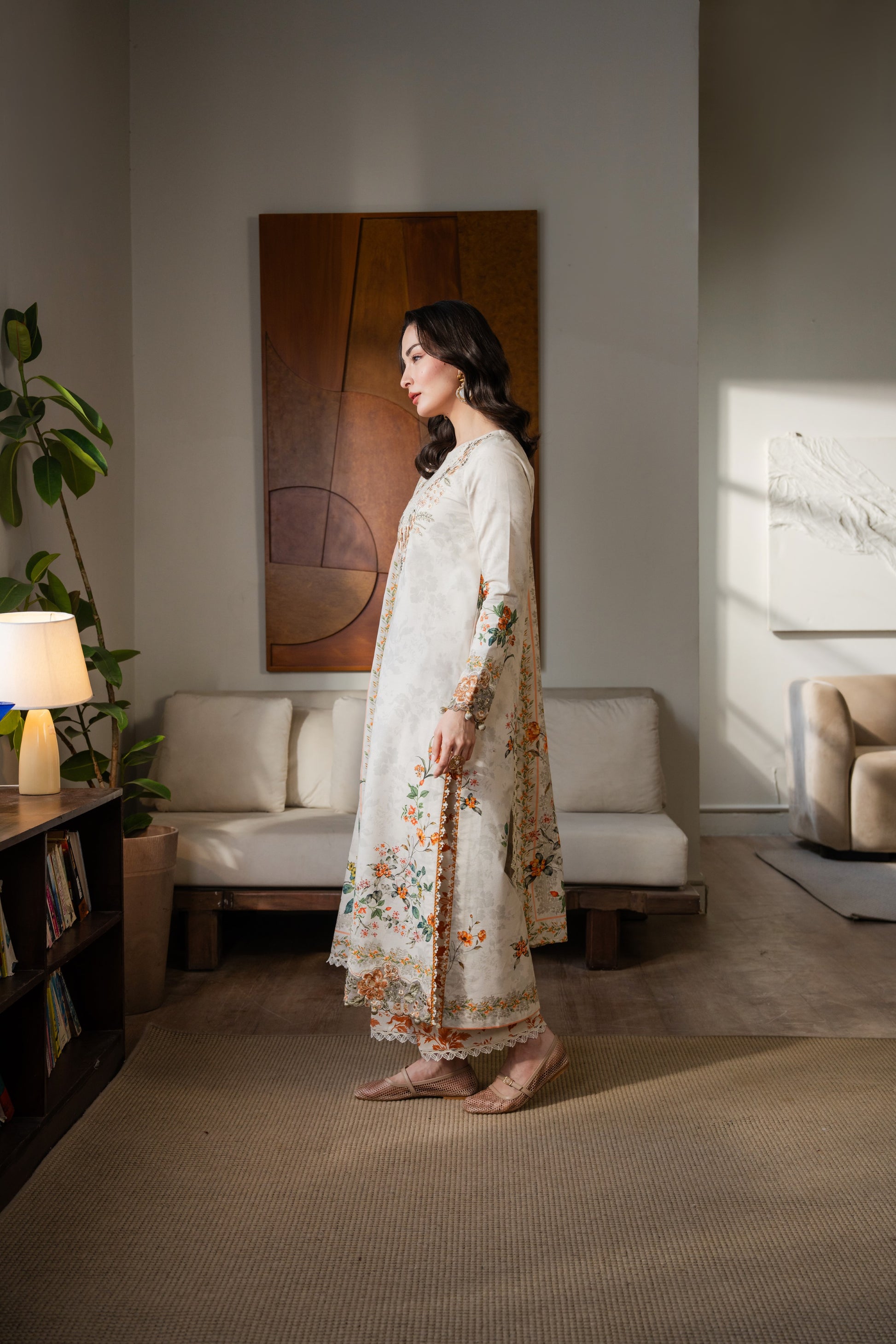 Printed khaddar dress with embroidered organza details and simple dyed trousers.