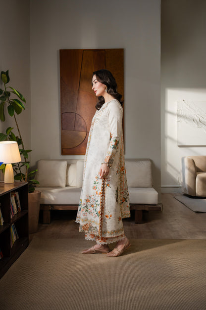 Printed khaddar dress with embroidered organza details and simple dyed trousers.