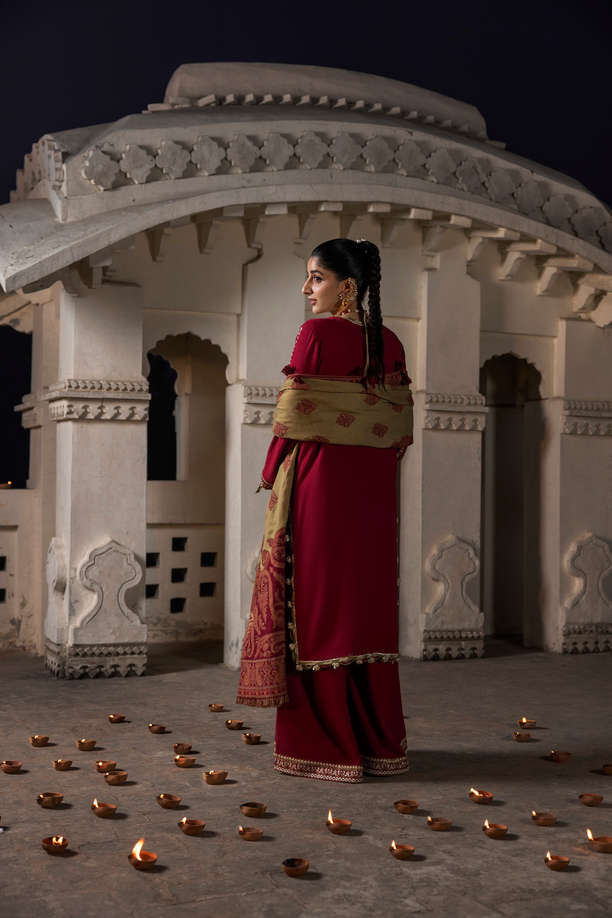 A winter dress styled with a warm shawl over a simple embroidered shirt and trouser.