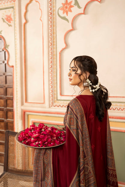 Elegant unstitched Dhanak suit with rich embroidery and jacquard shawl, designed for winter formals or parties.