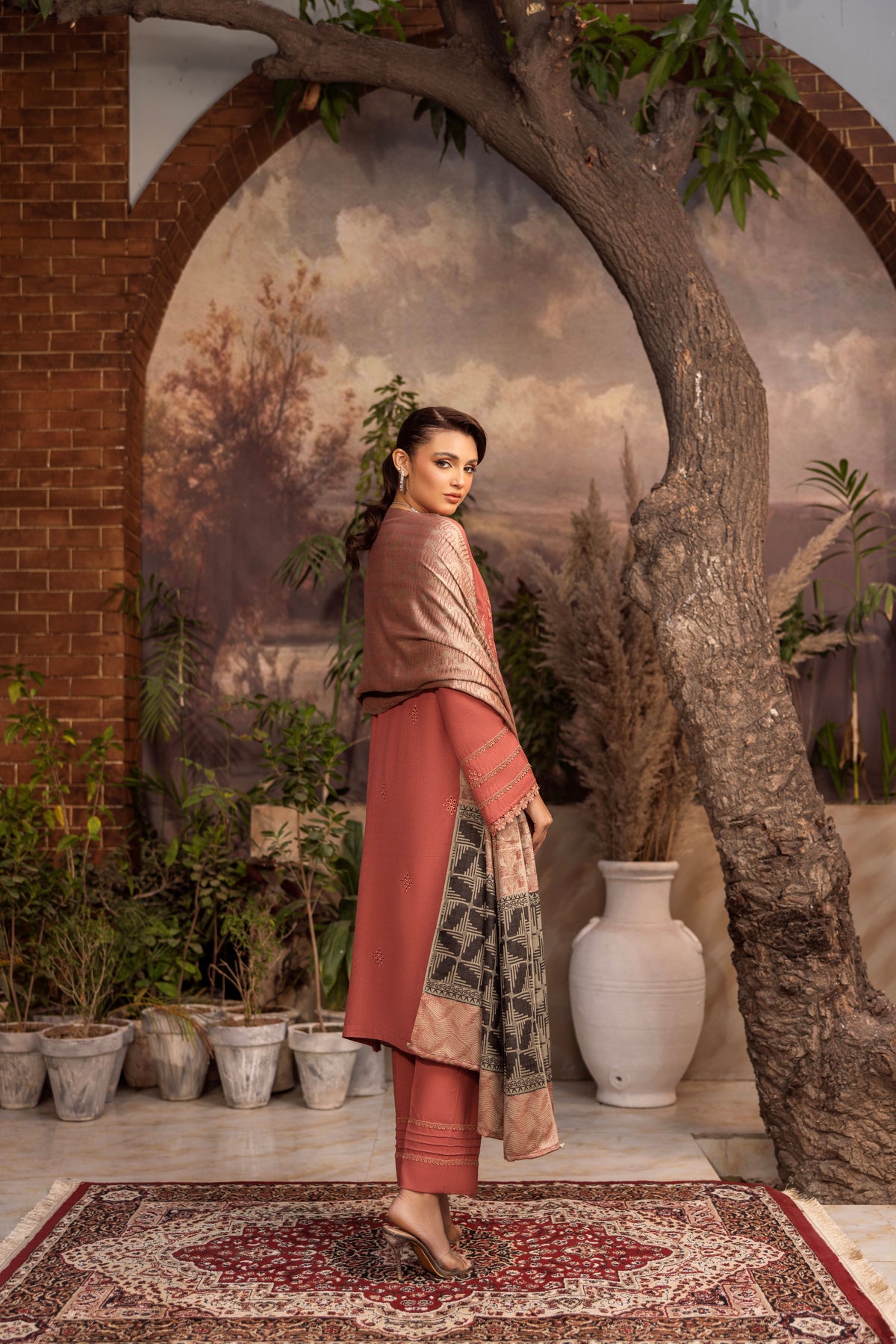 Thick winter embroidered suit with traditional motifs and detailed threadwork.