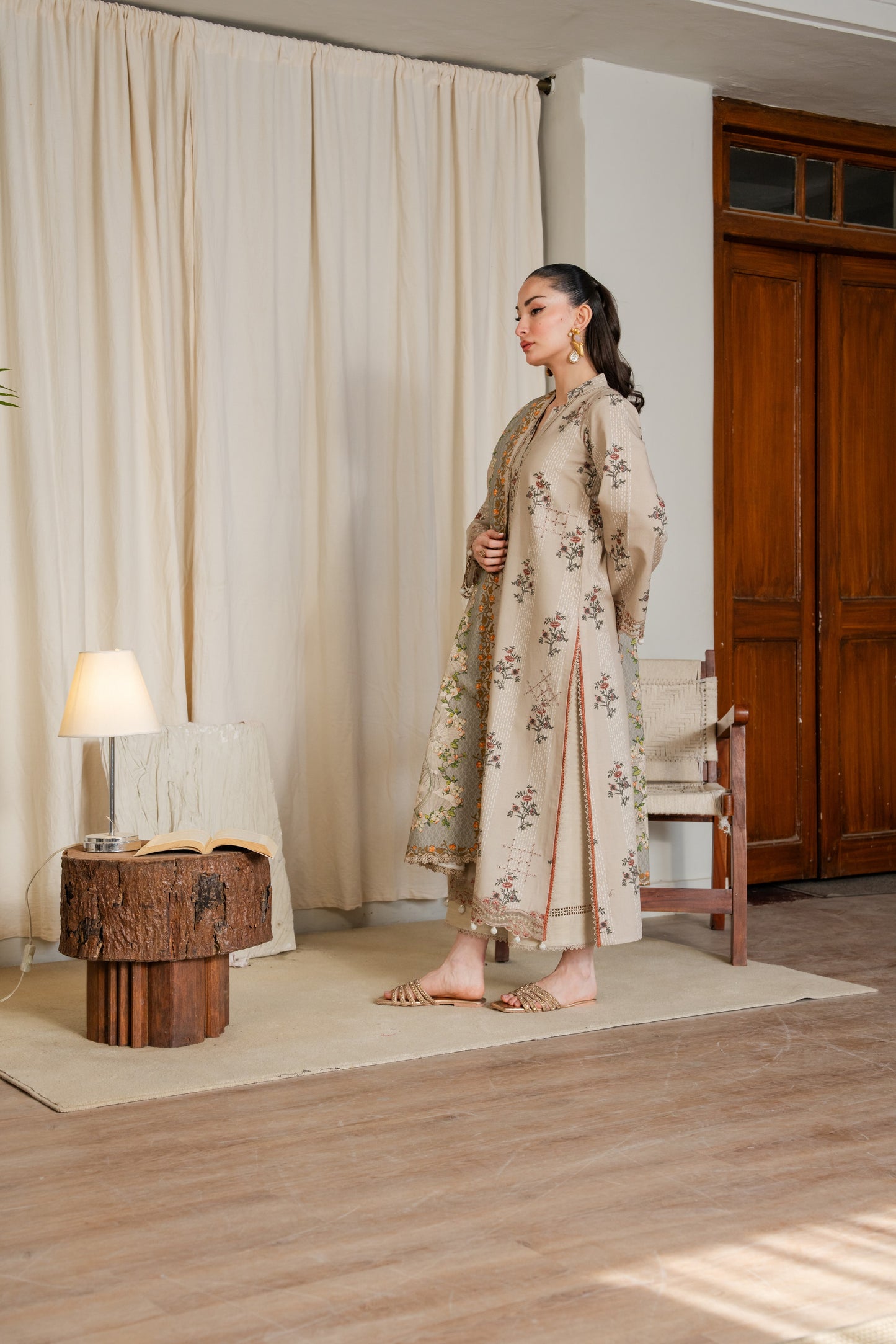 Embroidered khaddar dress with organza borders and printed dupatta for winter events.