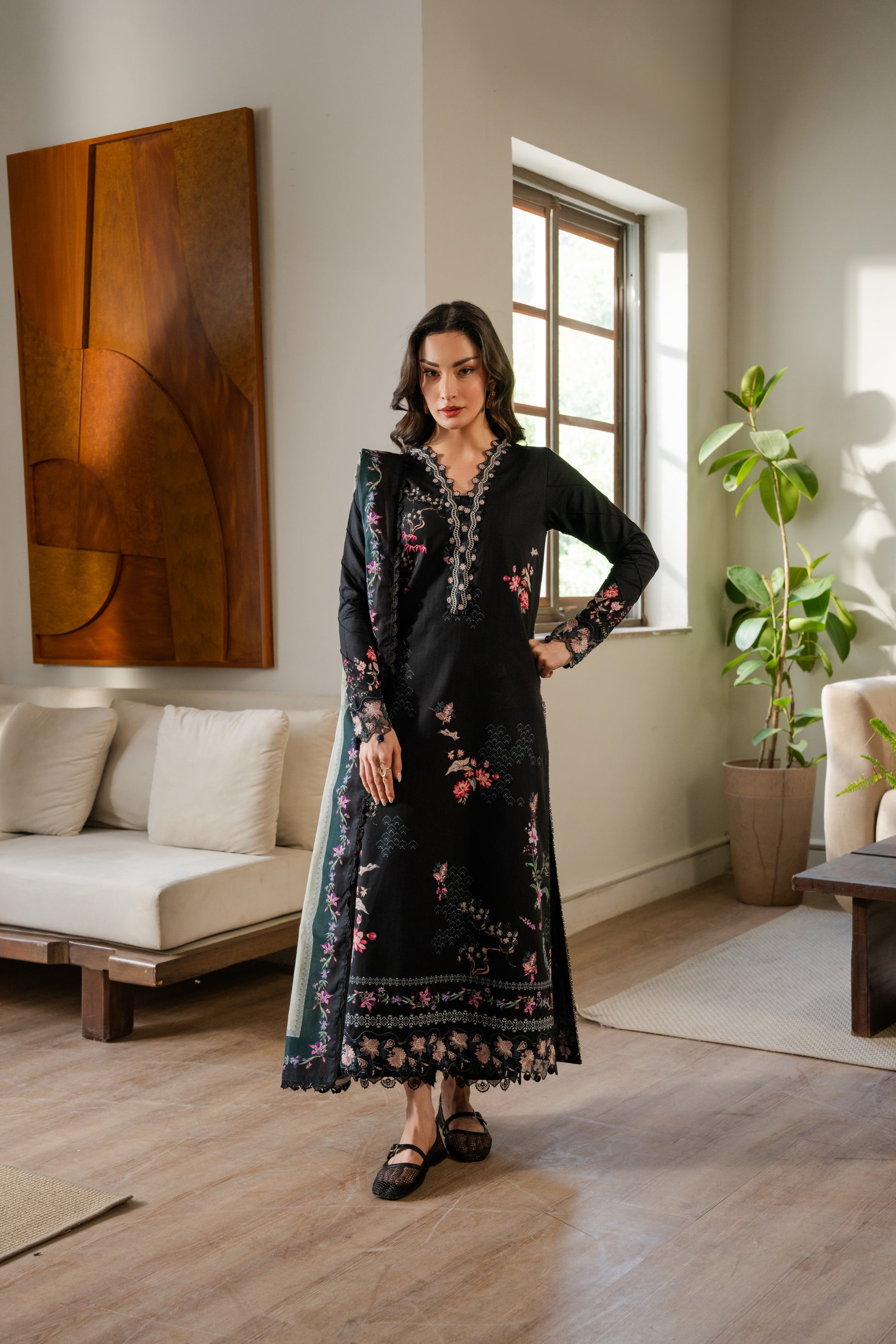 Printed khaddar shirt with embroidered borders, dyed trousers, and soft winter dupatta.