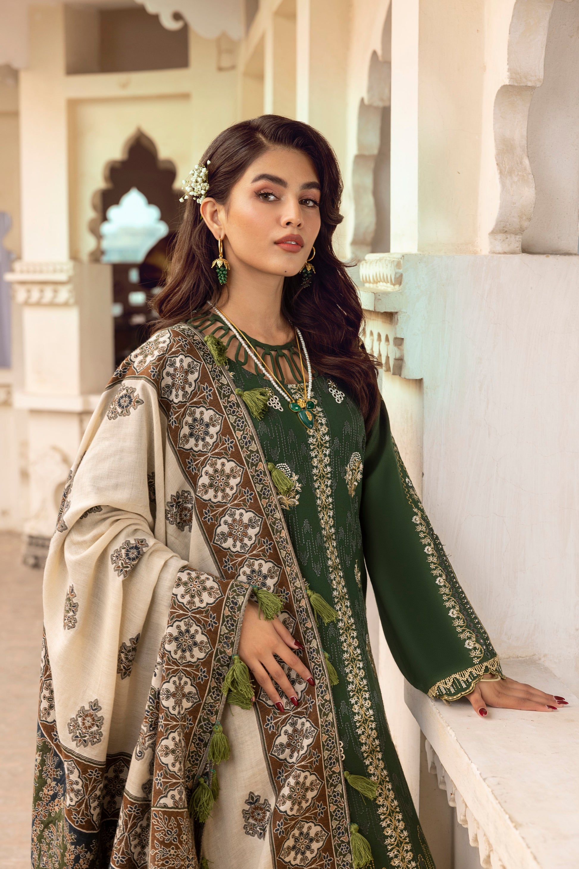 Luminous embroidered Marina wool dress paired with a handcrafted Kashmiri wrap and tailored trousers.