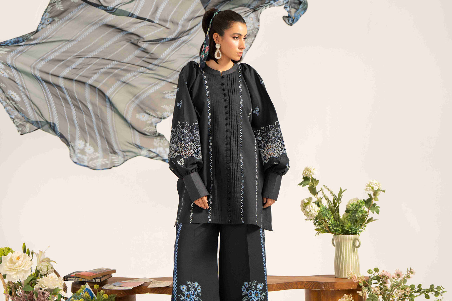 Stylish embroidered lawn shirt designed with chiffon dupatta and soft cotton trouser.