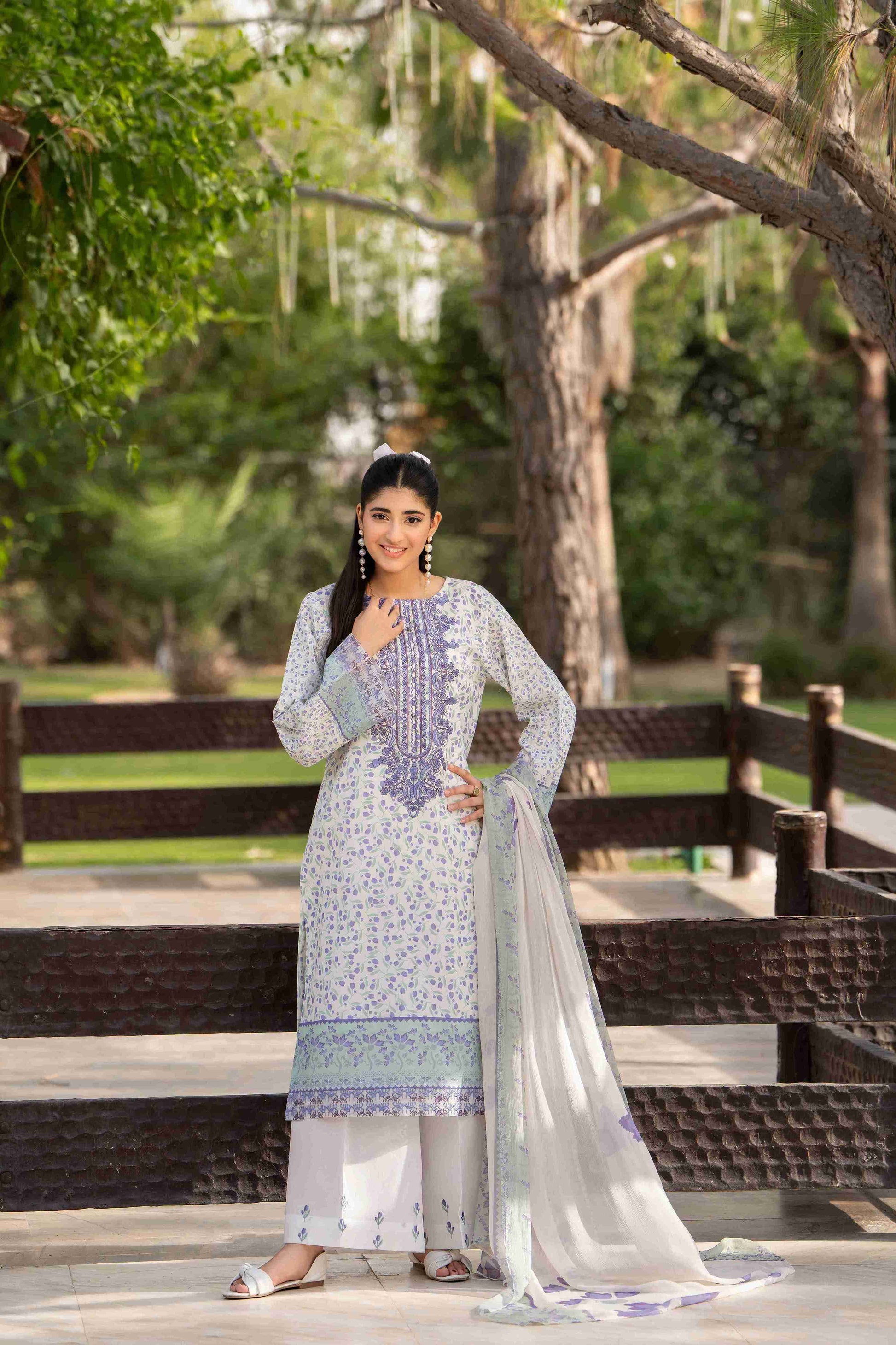 Delicate embroidered kurta with cotton trouser and chiffon dupatta, styled for summer gatherings
